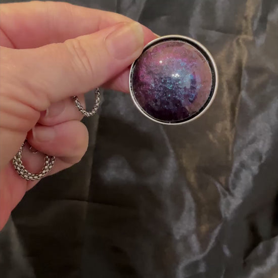 Video of the large blue and purple color shift domed round pendant showing how the colors change as the light hits it.