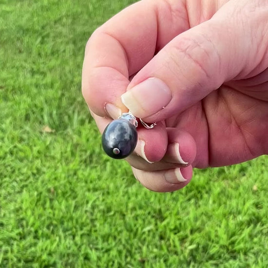 Silver Plated Pearly Gray Oval Drop Lucite Handmade Earrings video showing how the lucite has a glow like effect in the light. 