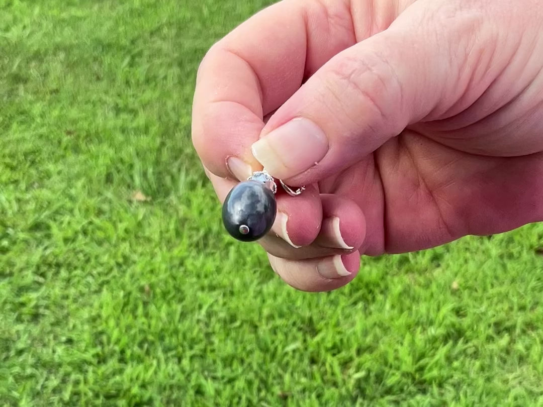 Silver Plated Pearly Gray Oval Drop Lucite Handmade Earrings video showing how the lucite has a glow like effect in the light. 