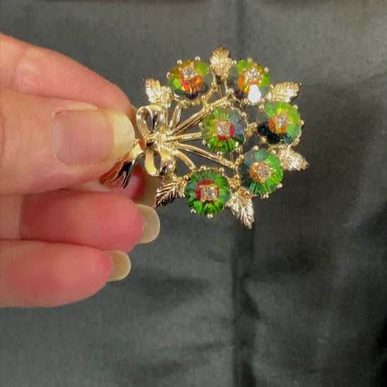 1960's Emmons Watermelon and Clear Rhinestone Vintage Flowers Brooch Pin showing how the rhinestones sparkle in the light.