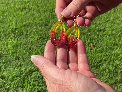 Fiery Red Orange and Yellow Resin Handmade Earrings video showing how the glitter sparkles in the light.