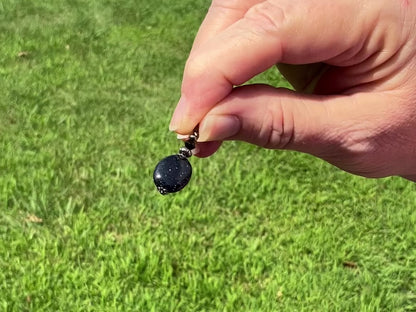 Gunmetal Plated Dark Blue Goldstone Glass Beaded Handmade Drop Earrings video showing how the glitter sparkles in the light.