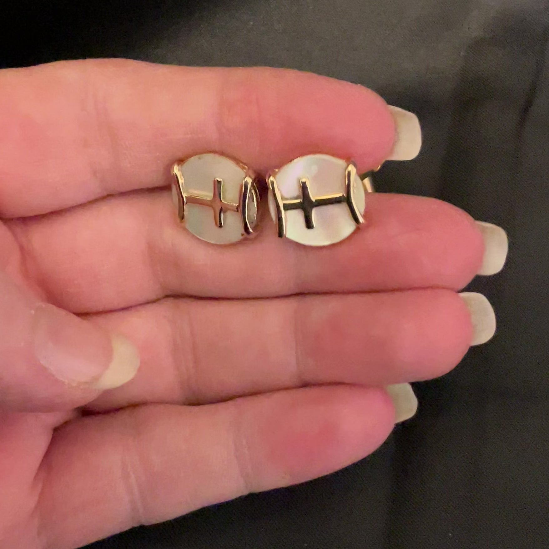 Mother of Pearl Vintage Angled Back Cufflinks video showing how the shell has flashes of pearly color in the light.