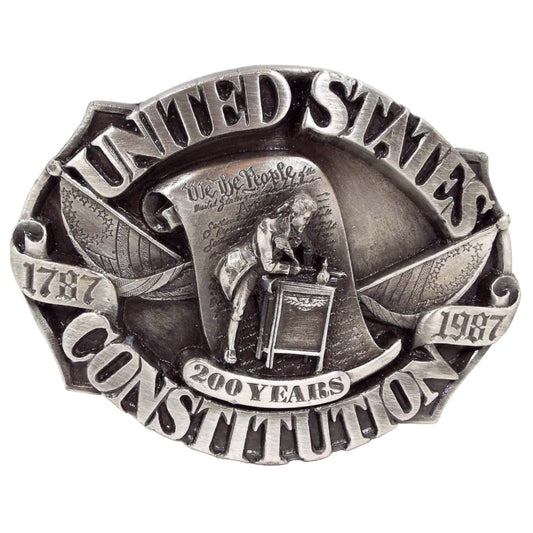 Front view of the limited edition retro vintage Siskiyou United States Constitution belt buckle. It is pewter gray in color. It has United States Constitution , 1787, 1987, and 200 years on the front with a depiction of it being signed with We the People.