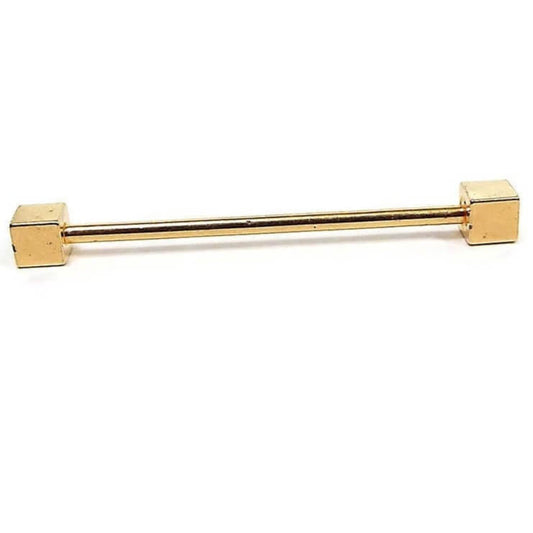 Side view of the retro vintage geometric style cube end collar bar. It is gold tone in color with square ends.