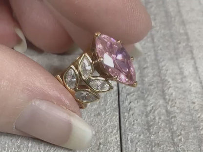Video showing the sparkle on the rhinestones of the retro vintage Edco cocktail ring with pink and clear marquis cut rhinestones.
