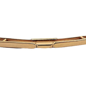 Front view of the 1950's Mid Century vintage Swank collar clip. It is gold tone in color and has a plain classic smooth style curved bar design in the front. 