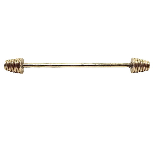 Side view of the Mid Century vintage collar bar. It's gold tone in color and has spiral style cone ends.