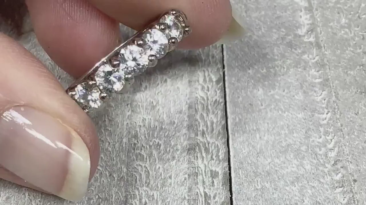 Video of the retro vintage sterling silver cubic zirconia ring. There are round clear CZ stones across the top of the band. The video shows how they sparkle. 
