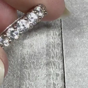 Video of the retro vintage sterling silver cubic zirconia ring. There are round clear CZ stones across the top of the band. The video shows how they sparkle. 