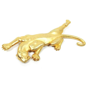 Front view of the retro vintage JJ panther brooch. It is matte gold tone in color and is shaped like a cougar that is climbing. 