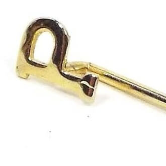 Enlarged view of the Mid Century vintage initial stick pin. The metal is gold tone in color. There is a small letter P at the top.