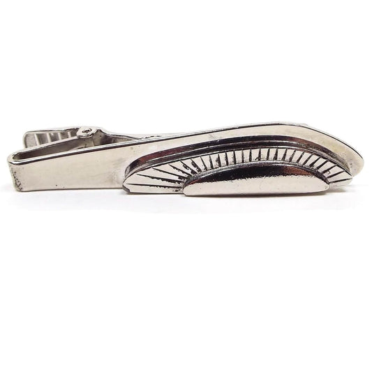 Front view of the Mid Century vintage modernist style tie clip. It has an abstract geometric curved design with different layers of the same shape.