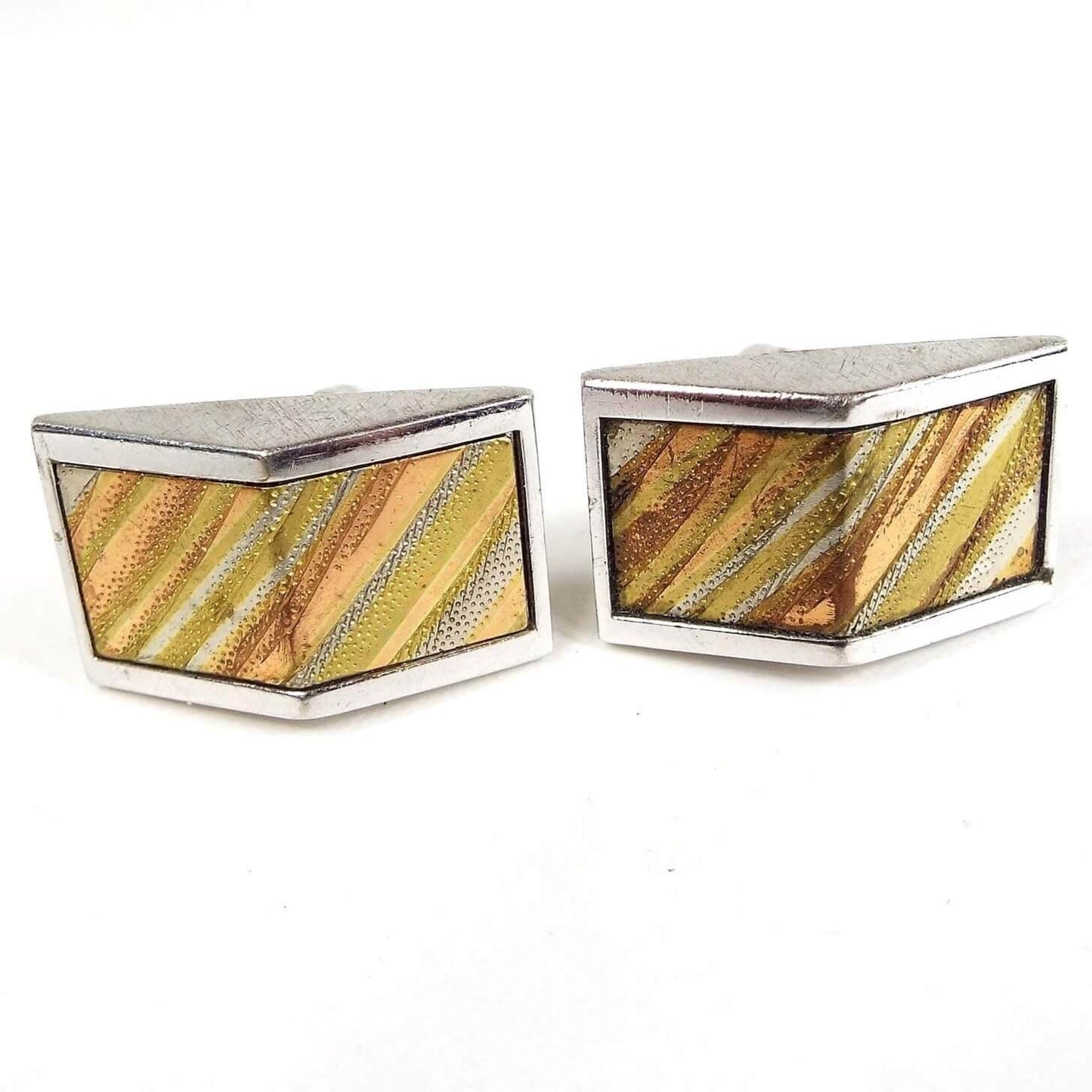 Front view of the retro vintage Anson tri color cufflinks. The front has an angled outward design. There are diagonal striped pieces of metal in silver tone, gold tone, brass color, rose gold color, and copper tone colored metals.