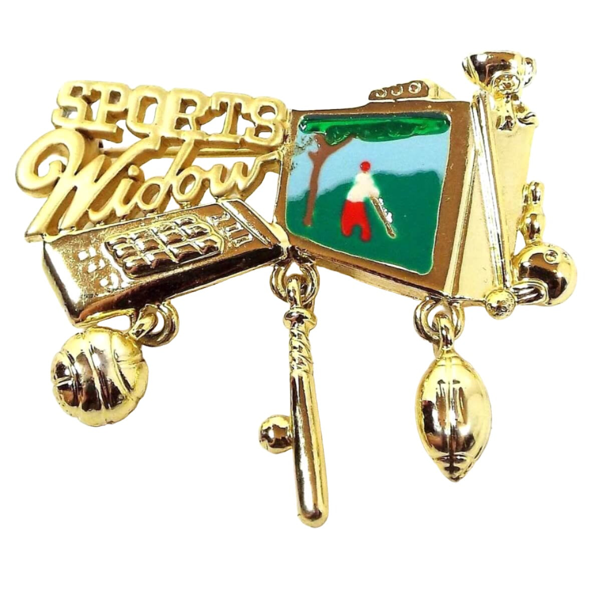Front view of the retro vintage Danecraft enameled brooch pin. The metal is gold tone in color. It has Sports Widow at the top with cut out style lettering. There is a TV remote, basketball, ball and bat, football, bowling ball and pin, trophy, and TV as part of the brooch. Three of them are charms that dangle below. The TV part has enameling with a depiction of someone playing golf on it.