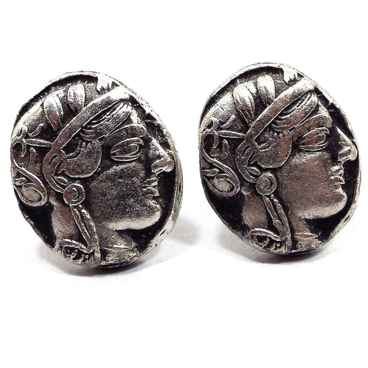 Front view of the retro vintage Athena Front Owl Back Greek Athens Tetradrachm Coin cufflinks. They are oval and antiqued silver tone in color. It has a depiction of Athena on the front.