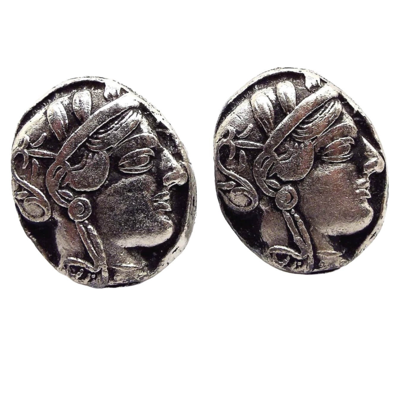 Front view of the retro vintage Athena Front Owl Back Greek Athens Tetradrachm Coin cufflinks. They are oval and antiqued silver tone in color. It has a depiction of Athena on the front.