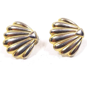 Front view of the retro vintage Direction One brand pierced earrings. They are gold tone in color and are corrugated shell shaped. 