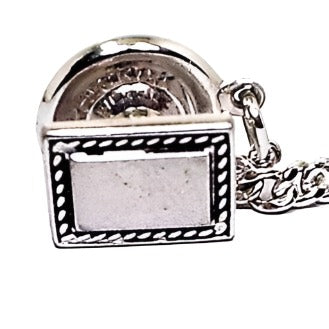 Front view of the Mid Century vintage Hickok rectangle tie tack. It is silver tone in color with a black design around the edge.