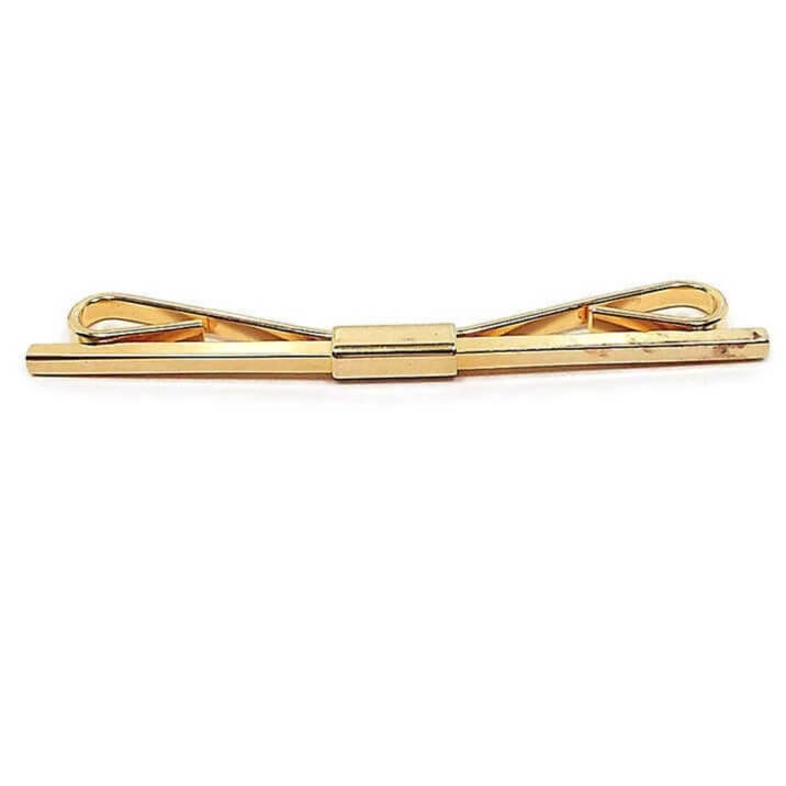 Front view of the long 1960's vintage collar clip. There is a squared bar across the front. The metal is gold tone in color.