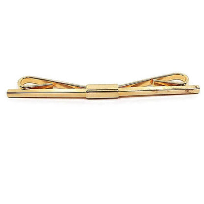 Front view of the long 1960's vintage collar clip. There is a squared bar across the front. The metal is gold tone in color.