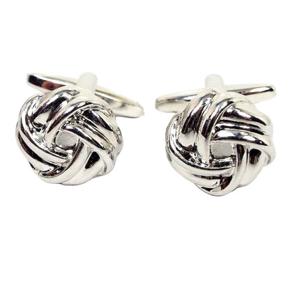 Front view of the retro vintage knot cufflinks. They are silver tone in color with a knot design. 