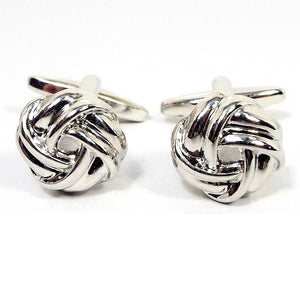 Front view of the retro vintage knot cufflinks. They are silver tone in color with a knot design. 