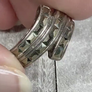 Video of the retro vintage sterling silver bypass ring with rectangle hematite stones. The video shows how the stones sparkle.