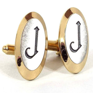 Front view of the Hickok Mid Century vintage initial cufflinks. They are oval in shape and mostly gold tone in color. The fronts have silver tone color metal with the letter J engraved on the front in black.