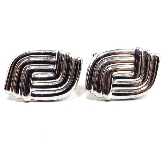 Front view of the Foster Mid Century vintage angled back cufflinks. They are silver tone in color and have a curved woven style design.