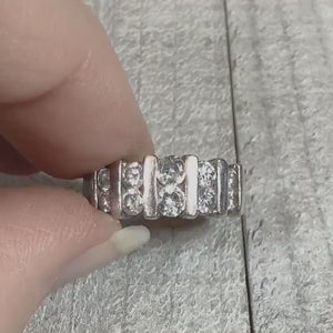 Video showing the sparkle on the retro vintage sterling silver cubic zirconia band ring. There are two rows of round cz stones on the top of the ring separated by vertical sterling bars.