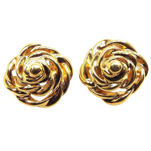 Front view of the retro vintage swirl earrings. They are gold tone in color and have a swirled and curved flower like design.