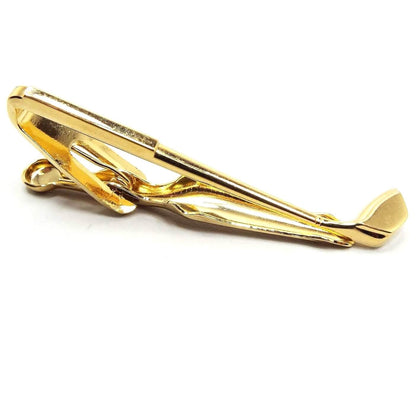Front view of the retro vintage golf club tie clip. It is gold tone in color and is shaped like a golf club.