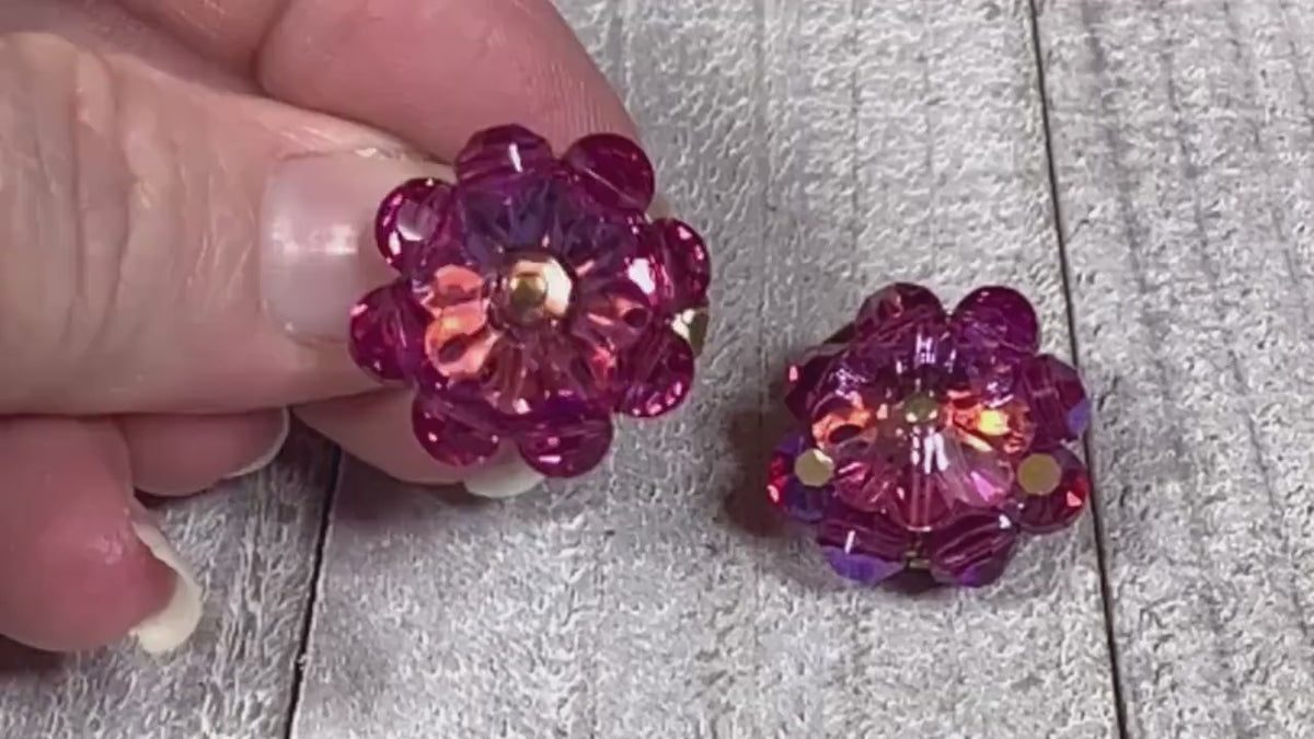 Video showing the sparkle on the Mid Century vintage pink glass crystal beaded clip on earrings.