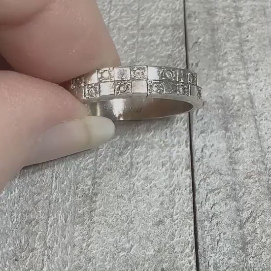 Video of the retro vintage sterling silver checkerboard band ring. There are small round cubic zirconia stones on every other square on the top of the ring. The video is showing how the CZ stones sparkle.