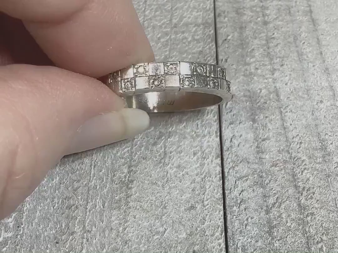 Video of the retro vintage sterling silver checkerboard band ring. There are small round cubic zirconia stones on every other square on the top of the ring. The video is showing how the CZ stones sparkle.