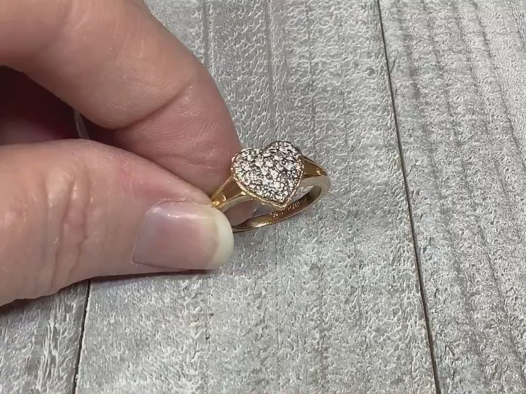Video of the retro vintage Ana BeKoach rhinestone ring. The ring is gold tone in color and has a heart shape at the top. The heart is encrusted with round clear rhinestones. The video is showing how the rhinestones sparkle.