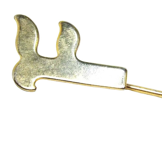 Enlarged view of the top part of the Mid Century Vintage initial stick pin from the 1950's. The metal is gold tone in color. There is a flat curvy style letter F at the top.