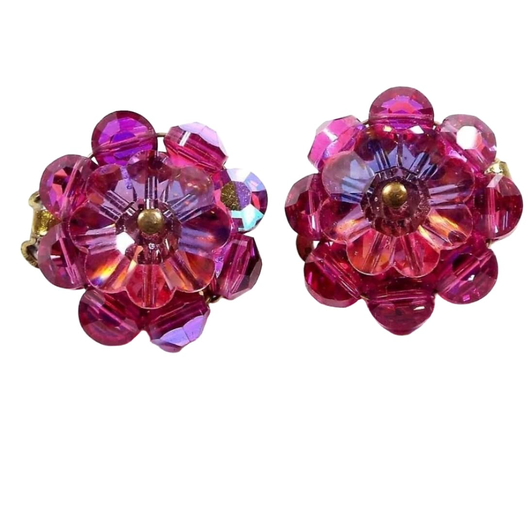 Front view of the Mid Century vintage beaded flower earrings. The glass crystal beads are bright pink and AB bright pink in color. There is a flower bead on the front and a row of faceted beads around the edge. 
