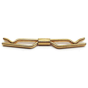 Side view of the Mid Century vintage angled collar clip. It is gold tone in color. The front has angled out areas in the middle.