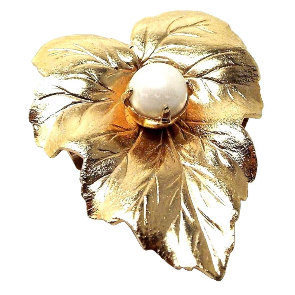 Front view of the Mid Century vintage Sarah Coventry leaf brooch. It is gold tone in color and has a faux pearl in the middle.