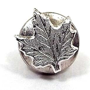 Front view of the retro vintage maple leaf tie tack. The metal is textured matte silver tone in color. It has a maple leaf shape design with etched leaf veins. The round clutch can be seen on the back and is the type with no chain.