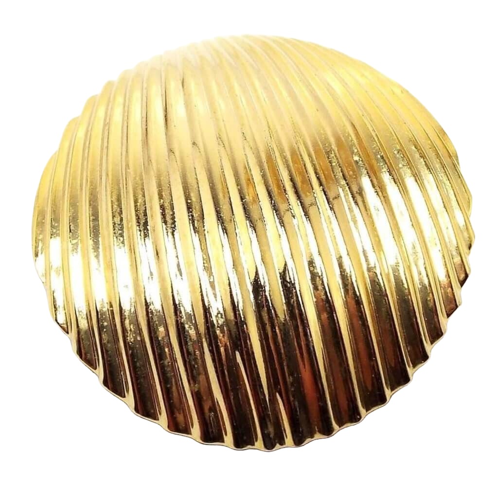 Front view of the retro vintage Kathie Lee scarf clip. The metal is gold tone in color. The scarf clip is round with a corrugated raised line design. 