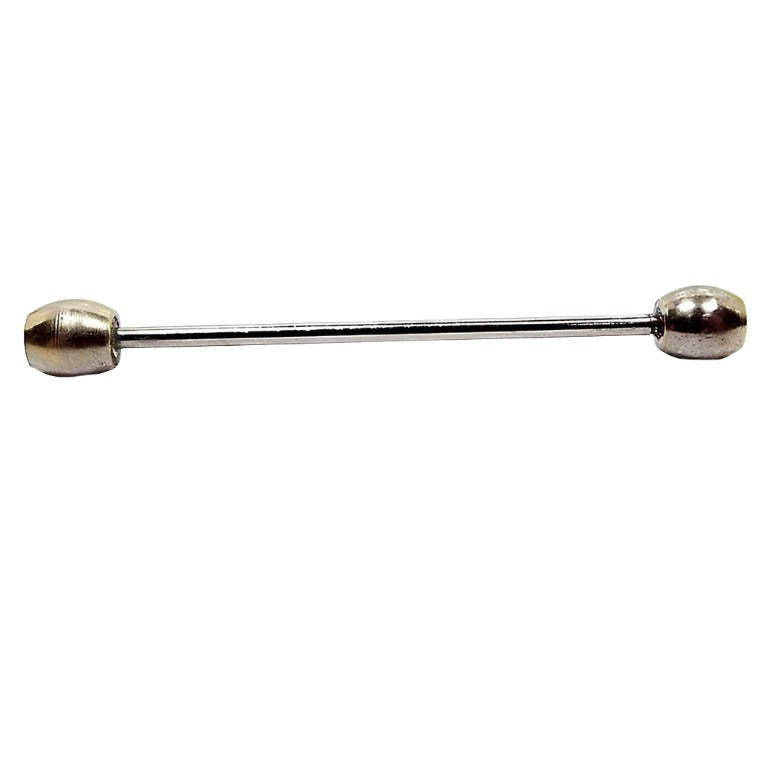 Side view of the Mid Century vintage two tone collar bar with oval ends. The ends are light gold tone in color. The bar is silver tone in color.